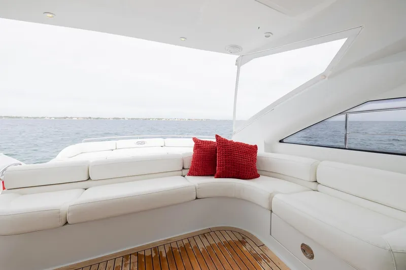 Slide: The Image of Luxurious 2007 Pershing 56 yacht interior with white seating and red cushions. - 35