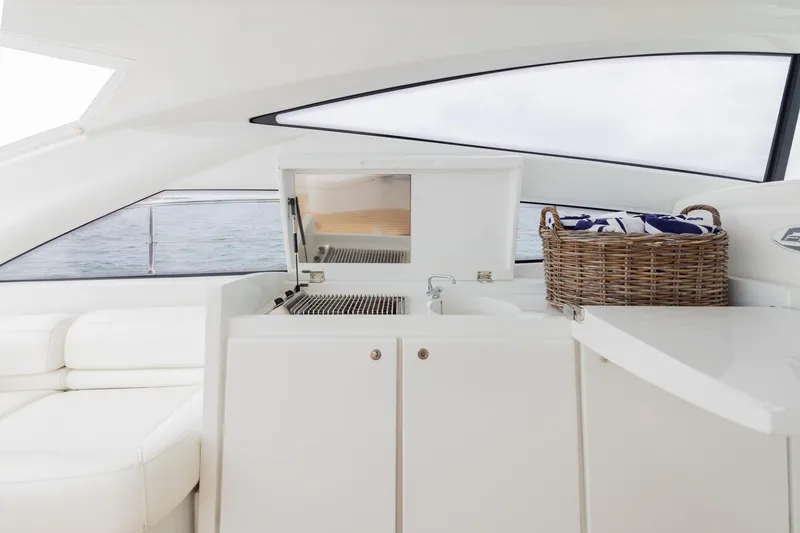 Slide: The Image of Luxurious interior of 2007 Pershing 56 yacht with sleek white cabinetry and wicker basket. - 37