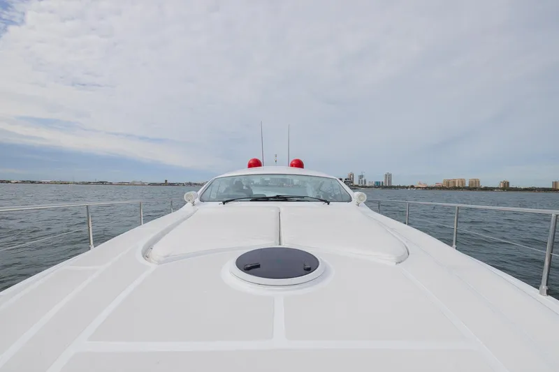 Slide: The Image of 2007 Pershing 56 yacht on open water with city skyline in background. - 40
