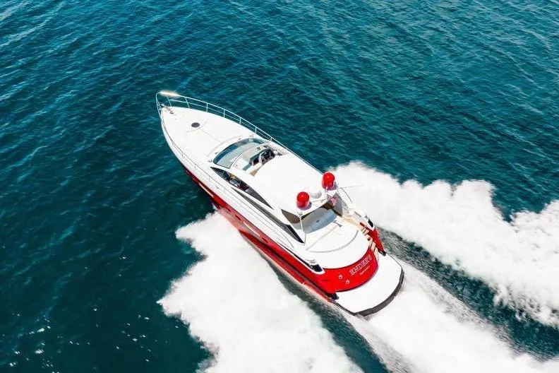Slide: The Image of Aerial view of a 2007 Pershing 56 yacht cruising on open water. - 6