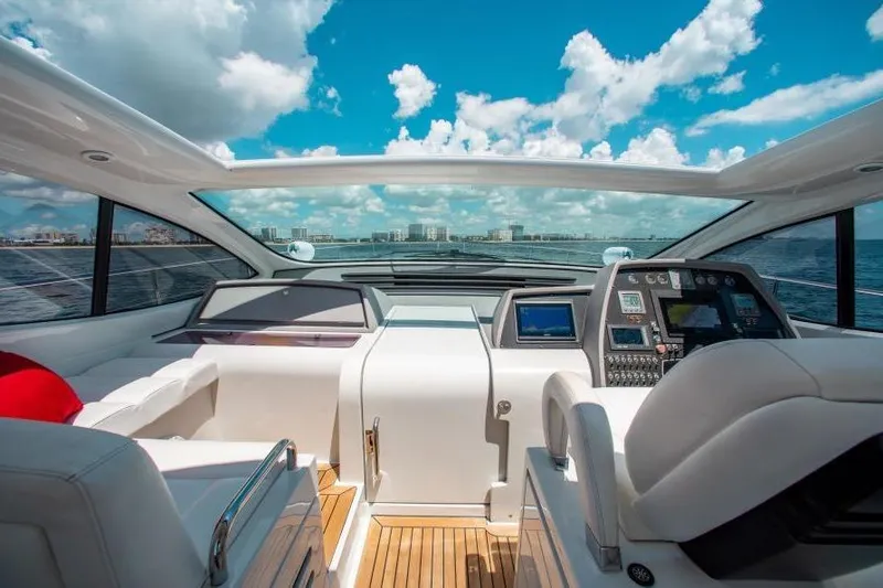 Slide: The Image of Interior view of 2007 Pershing 56 yacht cockpit with ocean and sky backdrop. - 8