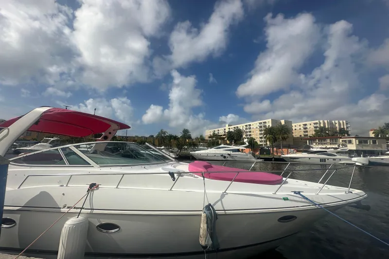 Slide: The Image of 2001 Sea Ray 340 Sundancer docked at marina under blue sky. - 19