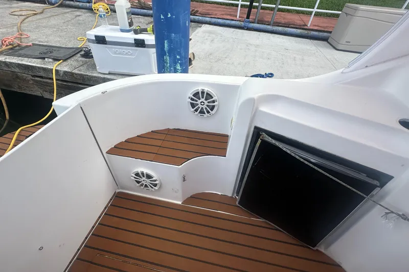 Slide: The Image of 2001 Sea Ray 340 Sundancer boat deck with speakers and storage compartment. - 30