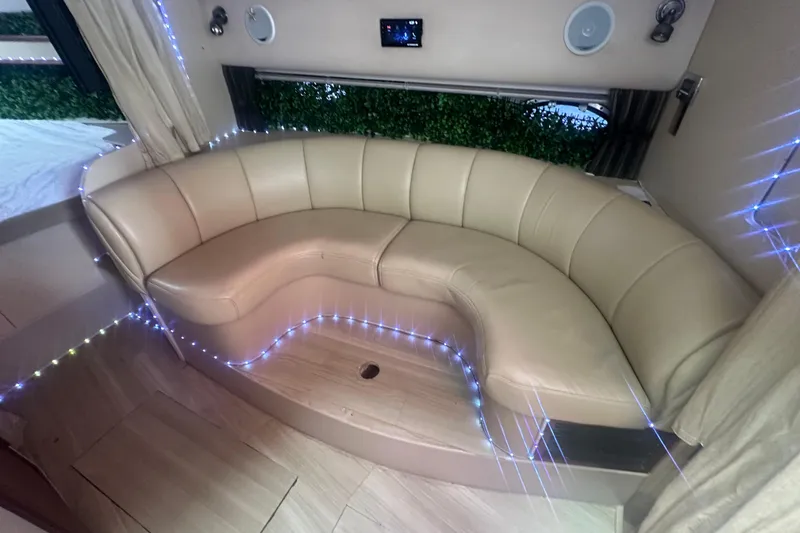 Slide: The Image of Luxurious beige leather seating in 2001 Sea Ray 340 Sundancer cabin with ambient lighting. - 37