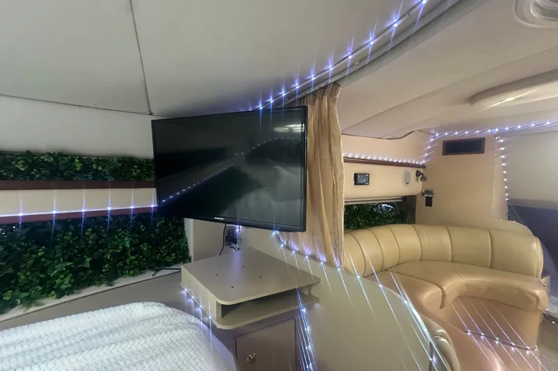 Slide: The Image of Interior of 2001 Sea Ray 340 Sundancer with TV, seating, and decorative lighting. - 39