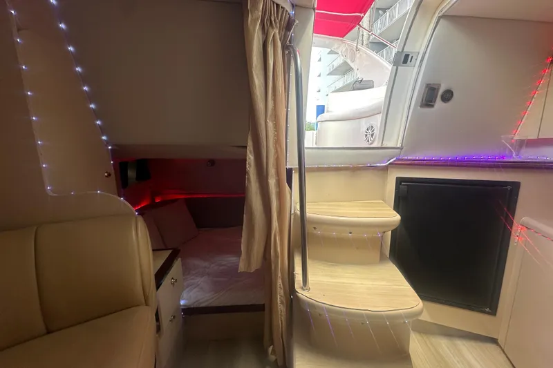 Slide: The Image of Interior of 2001 Sea Ray 340 Sundancer with cozy cabin and ambient lighting. - 41