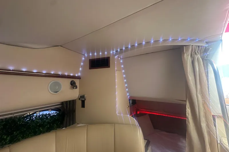 Slide: The Image of Interior of 2001 Sea Ray 340 Sundancer with ambient lighting and cozy seating area. - 42