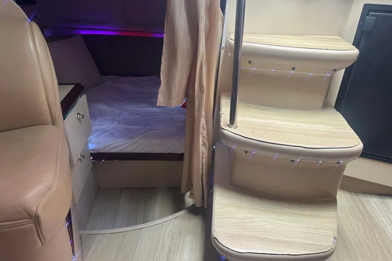 Slide: The Image of Interior cabin of 2001 Sea Ray 340 Sundancer with bed and stairs. - 44