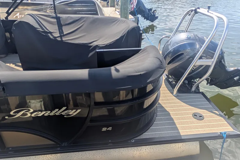 Slide: The Image of 2022 Bentley Pontoons 240 Navigator docked with Yamaha outboard motor. - 3