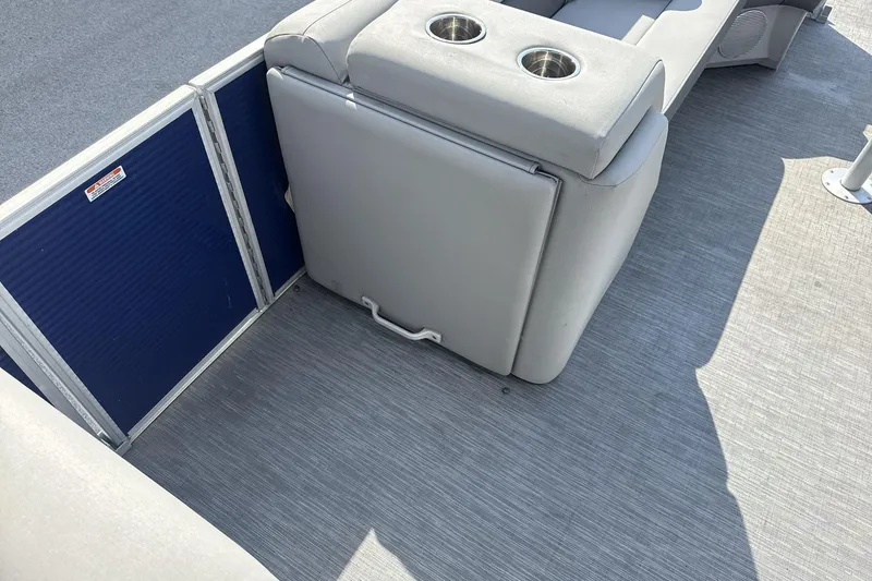 Slide: The Image of 2023 Bennington 25ssrc boat interior with gray seating and cup holders. - 12