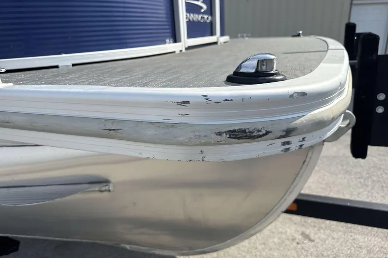 Slide: The Image of 2023 Bennington 25ssrc pontoon boat with visible hull scratches. - 19