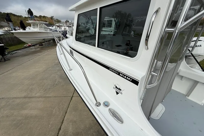 Slide: The Image of 2026 Steiger Craft 255 Miami boat docked, showcasing sleek design and modern features. - 15