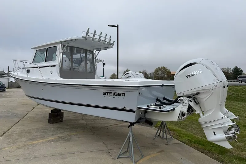Slide: The Image of 2026 Steiger Craft 255 Miami boat with Yamaha engines on display outdoors. - 3