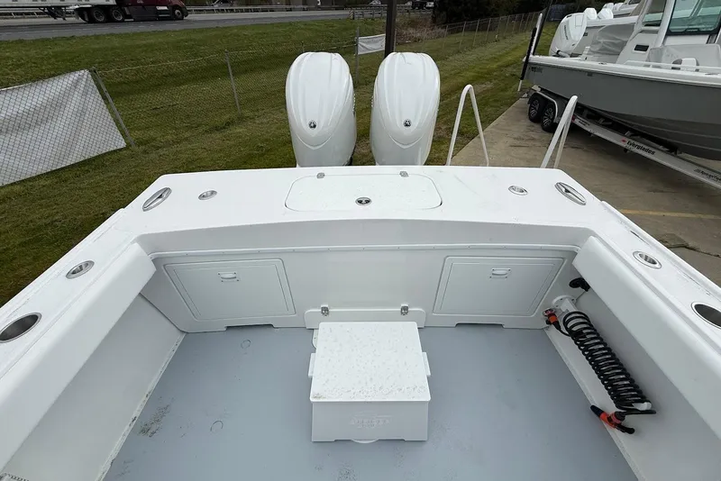 Slide: The Image of 2026 Steiger Craft 255 Miami boat deck with twin outboard motors. - 6