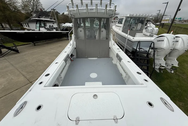 Slide: The Image of 2026 Steiger Craft 255 Miami boat with spacious deck and dual Yamaha engines. - 7