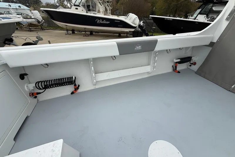 Slide: The Image of 2026 Steiger Craft 255 Miami boat interior, showcasing spacious deck and storage features. - 9