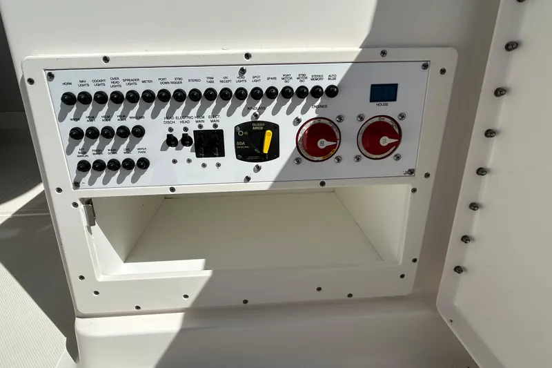 Slide: The Image of Control panel of a 2016 Pursuit DC 265 Dual Console boat. - 13