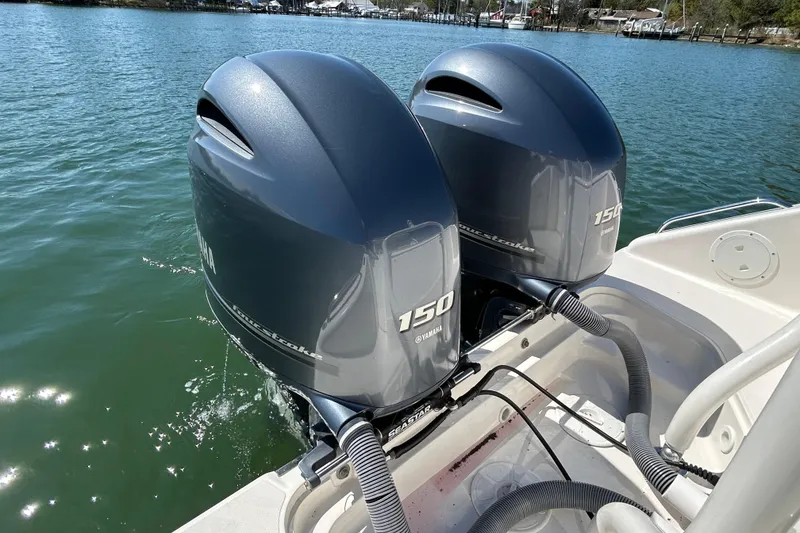 Slide: The Image of Twin Yamaha 150 outboard engines on a 2016 Pursuit DC 265 Dual Console boat. - 20
