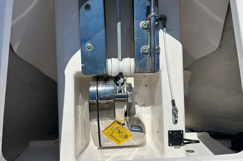 Slide: The Image of Anchor compartment of 2016 Pursuit DC 265 Dual Console boat. - 23