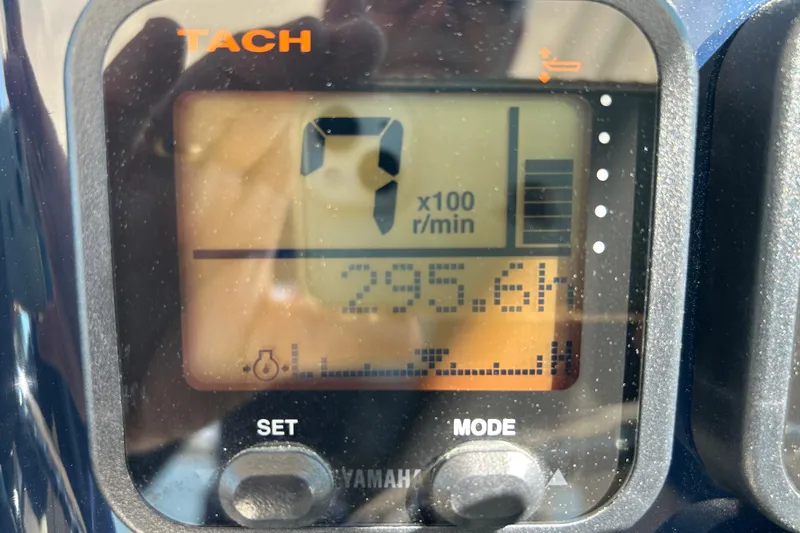 Slide: The Image of Close-up of a Yamaha tachometer on a 2016 Pursuit DC 265 Dual Console boat. - 6