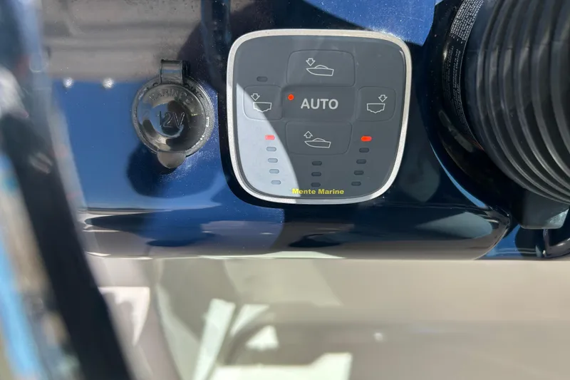 Slide: The Image of Control panel on a 2016 Pursuit DC 265 Dual Console boat dashboard. - 7