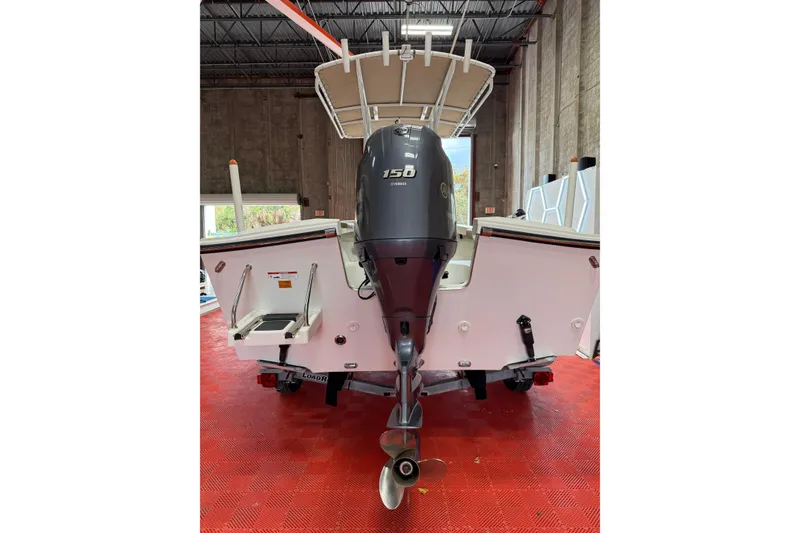 The Image of 2018 Parker 2100 SE boat with 150 horsepower engine in a warehouse setting. - 0