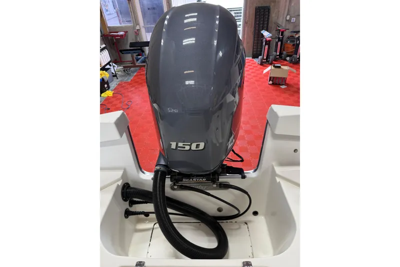 Slide: The Image of Outboard motor on 2018 Parker 2100 SE boat, featuring a 150 horsepower engine. - 1