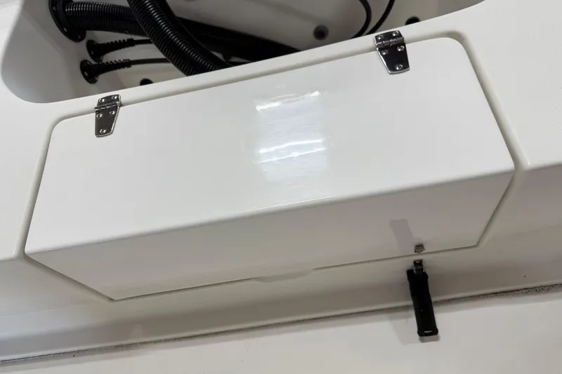 Slide: The Image of Storage compartment on a 2018 Parker 2100 SE boat, featuring secure latches. - 10