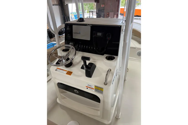Slide: The Image of 2018 Parker 2100 SE boat console with Garmin navigation system and steering wheel. - 15