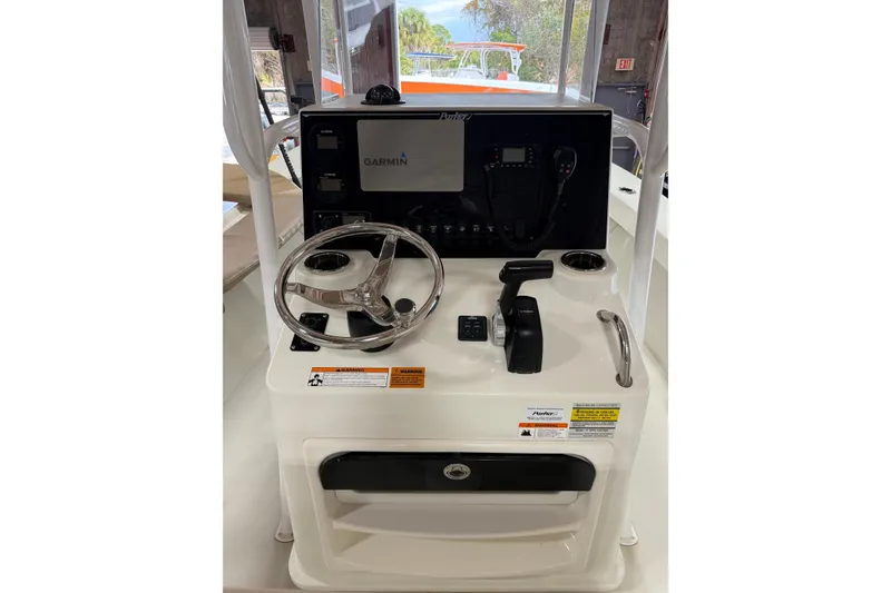 Slide: The Image of 2018 Parker 2100 SE boat console with Garmin navigation system and steering wheel. - 17