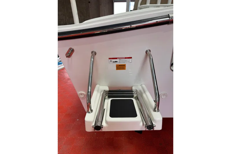 Slide: The Image of Rear view of 2018 Parker 2100 SE boat with swim platform and ladder. - 2