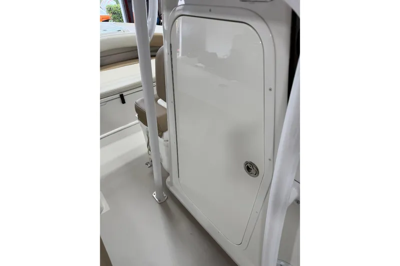 Slide: The Image of 2018 Parker 2100 SE boat interior with storage compartment and seating. - 20