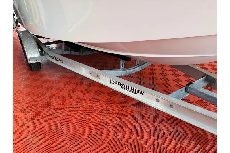Slide: The Image of 2018 Parker 2100 SE boat on Load Rite trailer, red checkered floor. - 27