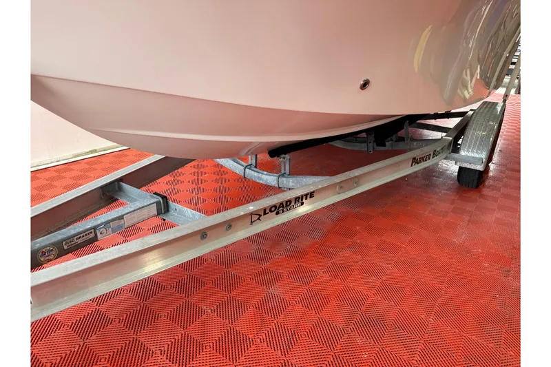 Slide: The Image of 2018 Parker 2100 SE boat on Load Rite trailer, red checkered floor. - 28