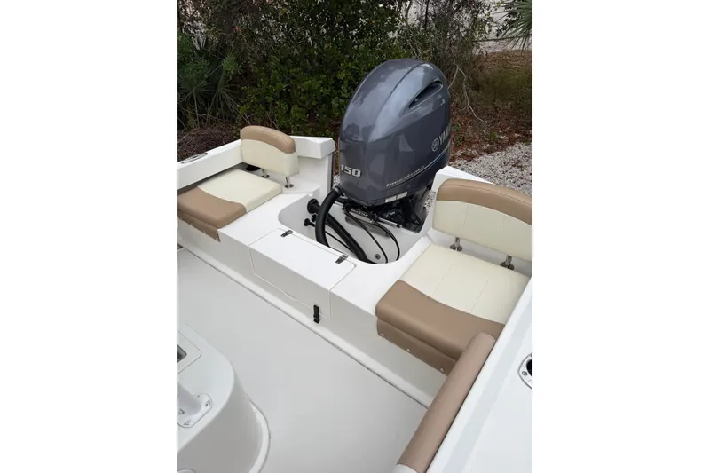 Slide: The Image of 2018 Parker 2100 SE boat interior with Yamaha outboard motor and cushioned seating. - 3