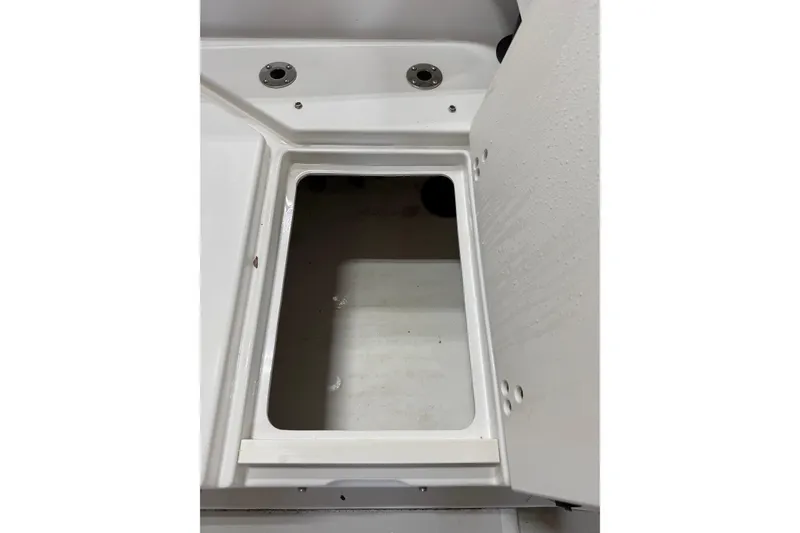 Slide: The Image of Open storage compartment on a 2018 Parker 2100 SE boat. - 7