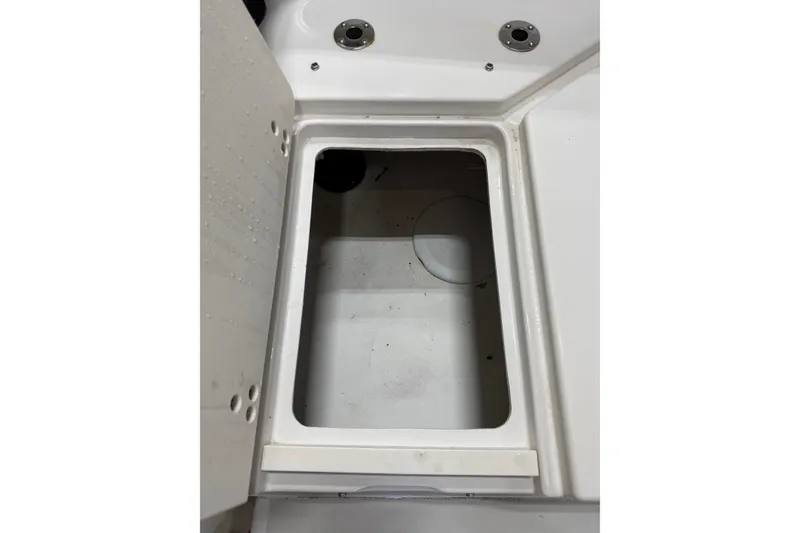 Slide: The Image of Open storage compartment on a 2018 Parker 2100 SE boat. - 9