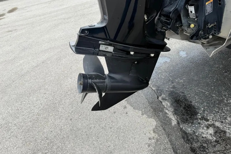 Slide: The Image of 2023 Bennington 25ssrc boat motor propeller on wet pavement. - 16