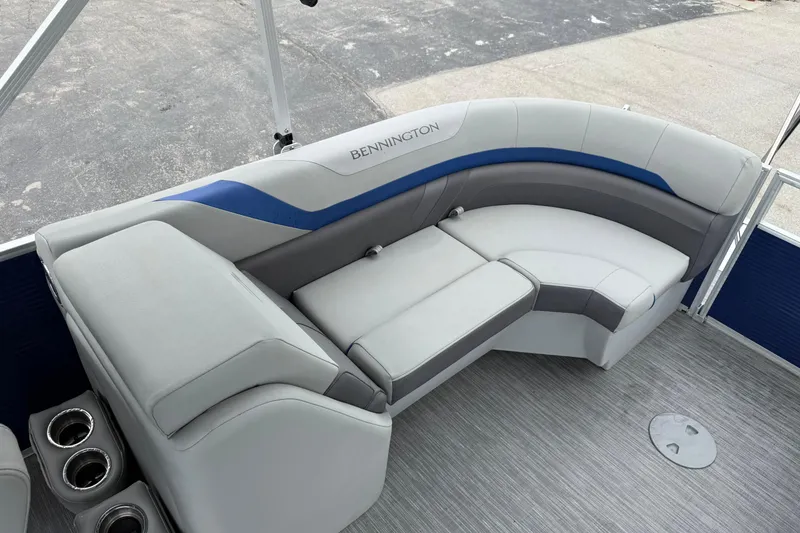 Slide: The Image of 2023 Bennington 25ssrc boat interior with plush seating and cup holders. - 20