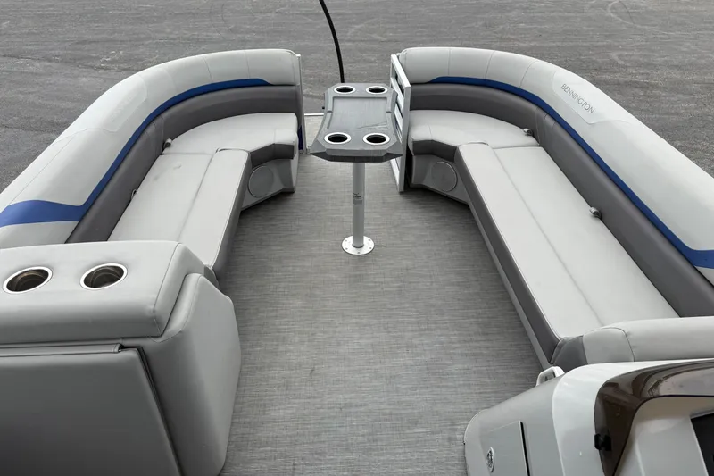 Slide: The Image of 2023 Bennington 25ssrc pontoon boat interior with gray seating and cup holders. - 21