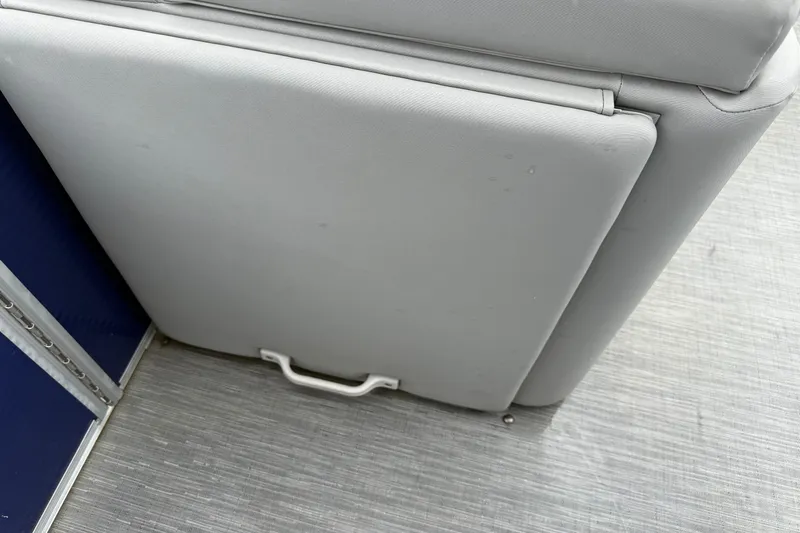 Slide: The Image of Gray seat cushion on 2023 Bennington 25ssrc boat, featuring a handle and textured flooring. - 25