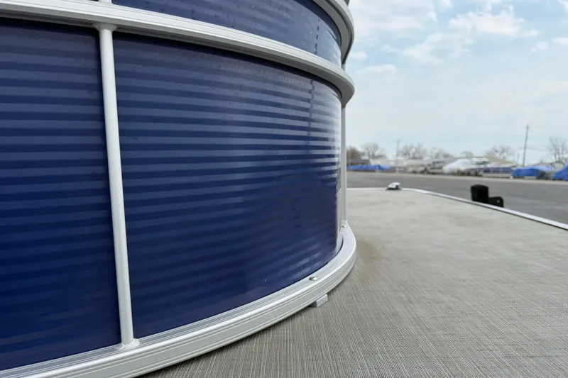 Slide: The Image of 2023 Bennington 25ssrc pontoon boat, close-up of blue exterior and deck. - 31