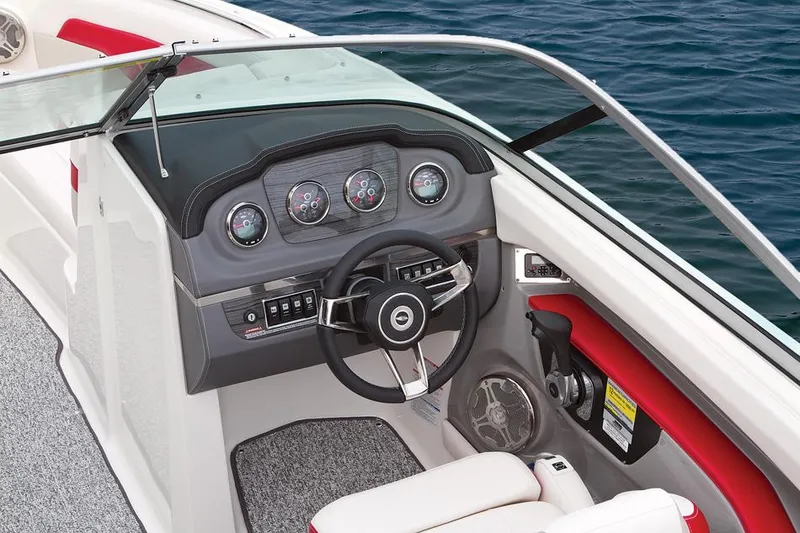 Slide: The Image of Manufacturer Provided Image: 2014 Chaparral 226 SSi boat dashboard with steering wheel and gauges. - 11