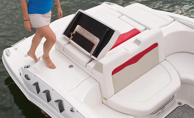 Slide: The Image of Manufacturer Provided Image: 2014 Chaparral 226 SSi boat with a person stepping onto the swim platform. - 16