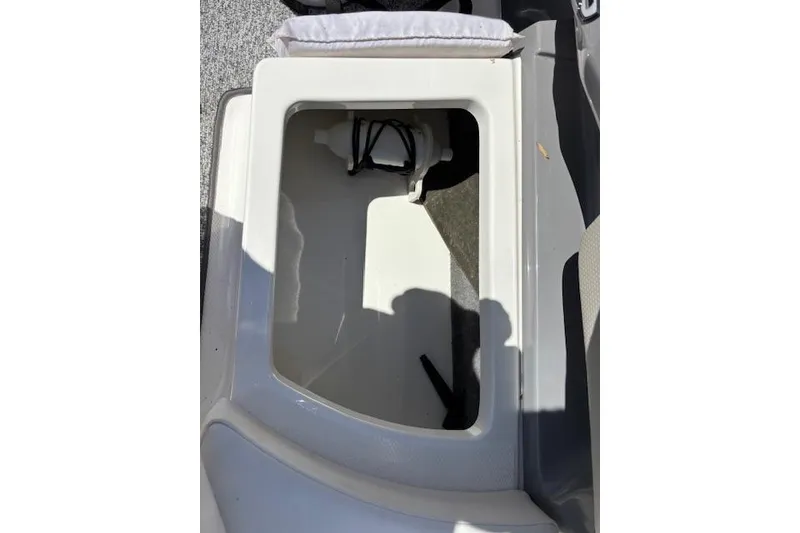 Slide: The Image of Open storage compartment in 2014 Chaparral 226 SSi boat interior. - 36