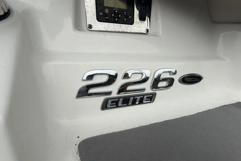 Slide: The Image of 2014 Chaparral 226 SSi Elite boat emblem on white surface. - 4