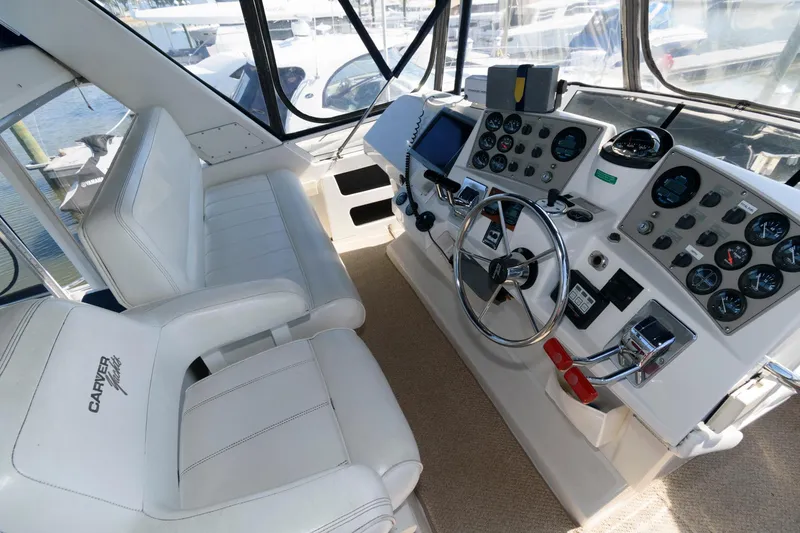 Slide: The Image of Interior of 1997 Carver 400 Cockpit Motor Yacht, helm with instruments. - 12