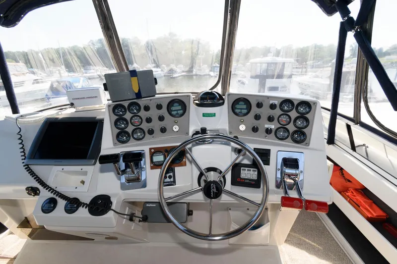 Slide: The Image of Cockpit of the 1997 Carver 400 Cockpit Motor Yacht. - 13