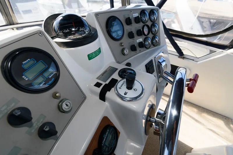 Slide: The Image of 1997 Carver 400 Cockpit Motor Yacht helm console. - 15