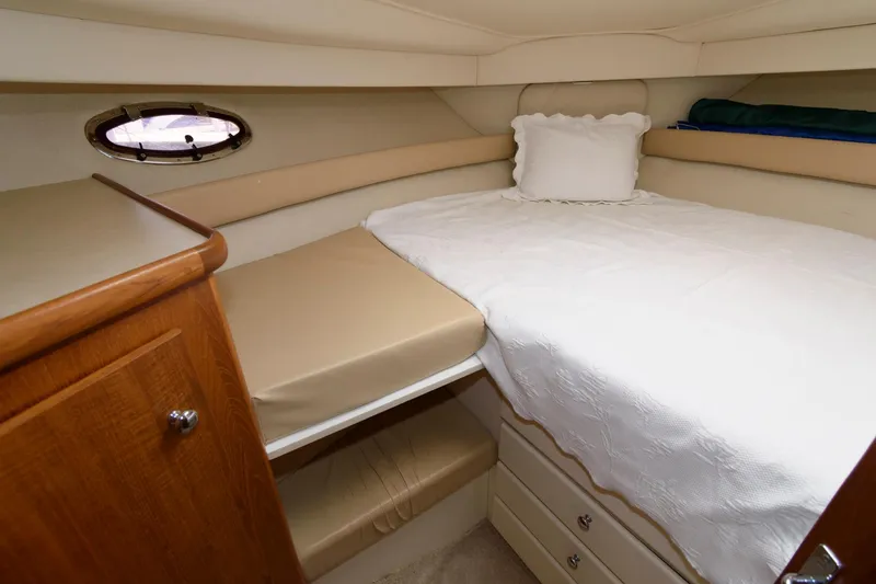 Slide: The Image of Interior of 1997 Carver 400 Cockpit Motor Yacht with cozy bed. - 29